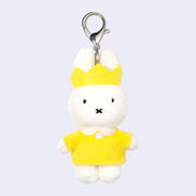 Plush keychain of Miffy wearing a yellow dress with a white collar and a yellow crown.