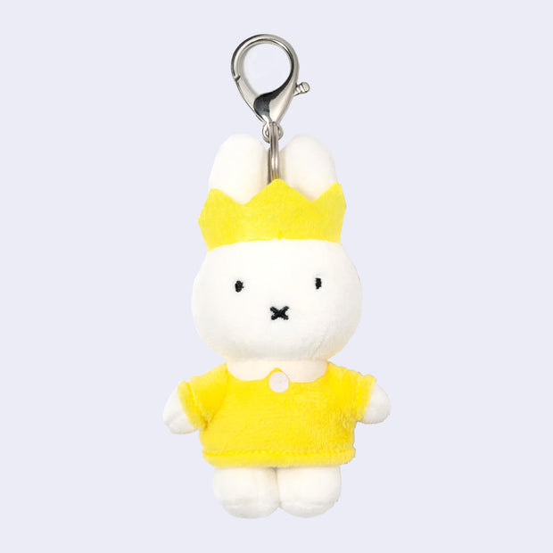 Plush keychain of Miffy wearing a yellow dress with a white collar and a yellow crown.