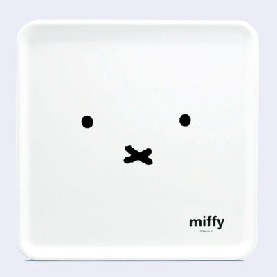 White square serving tray with a design of Miffy's face, close up so only her eyes and mouth are visible. In small text in the bottom right reads "Miffy"