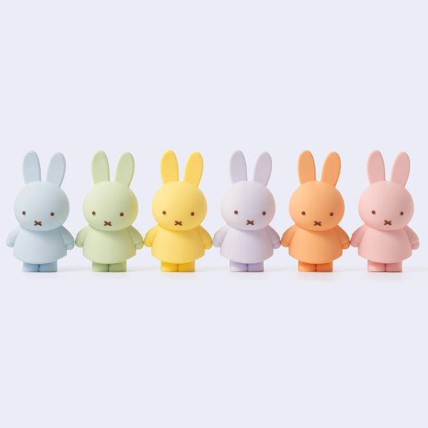 Row of 6 colorful Miffy figures, all in a different pastel colorway. Options are: blue, green, yellow, purple, orange or pink.
