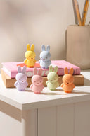Display of 6 colorful Miffy figures, all in a different pastel colorway. Options are: blue, green, yellow, purple, orange or pink.
