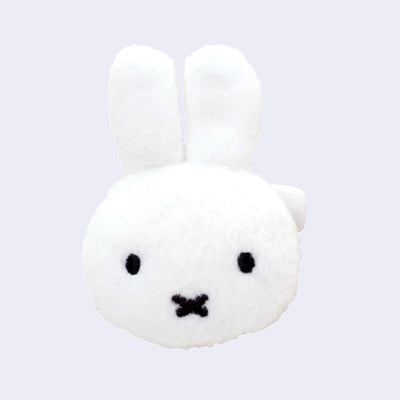 White plush toy of Miffy with black eyes and an x for a mouth.