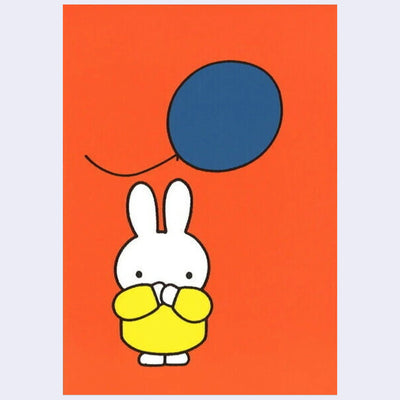 Postcard illustration of Miffy standing, with her hands over her mouth in surprise, as a large blue balloon flies by. Background is orange.