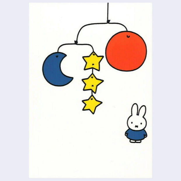 White postcard with an illustration of Miffy standing and looking at a mobile made up of stars, a moon and a sun.