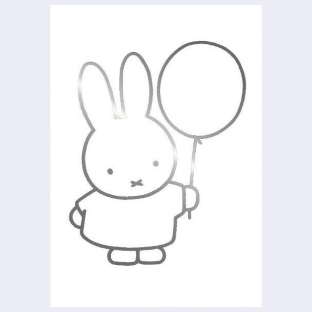 Silver foil line art illustration on a white postcard of Miffy holding a balloon.