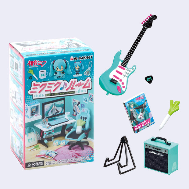 Set of 6 small miniature items themed around Hatsune Miku - an electric guitar, a spring onion, a DVD set of her best hits, a guitar stand, guitar pick and an amp.