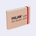 Sketchbook of watercolor paper with a beige cover and orange elastic band wrapping around it. Text on the front reads "Milan - 1420 The Master Gum"