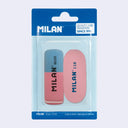 Blister pack of 2 erasers - one is half blue and half pink with bevelled edges and the other is oval shaped and pink. Both have Milan branding on them.