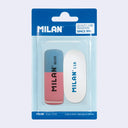 Blister pack of 2 erasers - one is half blue and half pink with bevelled edges and the other is oval shaped and white. Both have Milan branding on them.