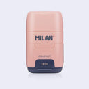 Pink and navy blue plastic case holding an eraser and a pencil sharpener within it, with 'Milan' branding on a light gray background