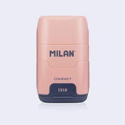 Pink and navy blue plastic case holding an eraser and a pencil sharpener within it, with 'Milan' branding on a light gray background