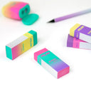 4 colorful rectangular erasers, with a cardboard sleeving with branding for "Milan - Sunset Series"