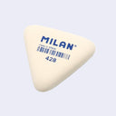 Triangular eraser with 'Milan' branding on a light gray background