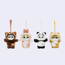 Four cute animal plush keychains in costumes on a light gray background