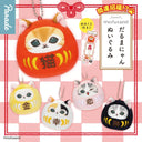 Set of cat daruma themed keychains with various expressions on a checkered background