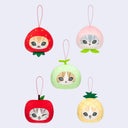Set of five fruit-shaped keychains with cat faces on a light gray background