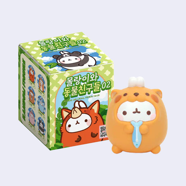Cute animal-themed blind box figure of a cartoon white rabbit wearing a costume, standing in front of its packaging.
