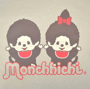 Close up of t-shirt graphic with two Monchhichi characters wearing matching red bibs and cheering with their hands up.