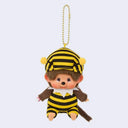 Plush keychain of Monchhichi in a bee costume on a light gray background