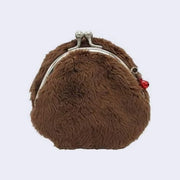 Brown furry coin purse with a red zipper accessory on a light gray background