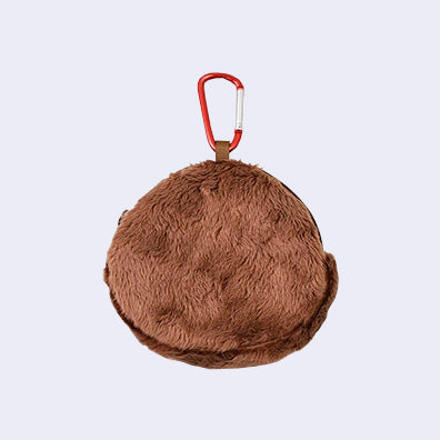 Plush zip top pouch of Monchhichi's head, round, with a red carabiner keychain attached.