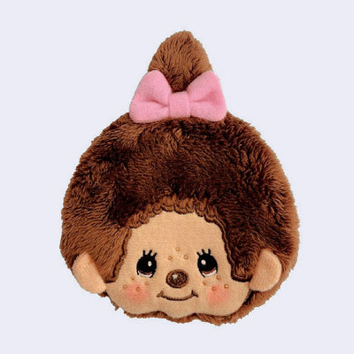 Fluffy coin pouched shaped like a Monchhichi's head with a cute, smiling face.
