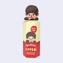 Monchhichi figure on top of a packaging box with 'Monchhichi Hippers' branding.