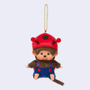 Plush Monchhichi monkey keychain wearing a red ladybug hat and blue overalls on a light gray background