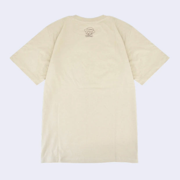 Back view of beige t-shirt with a small graphic of Monchhichi wearing a straw hat and smiling.
