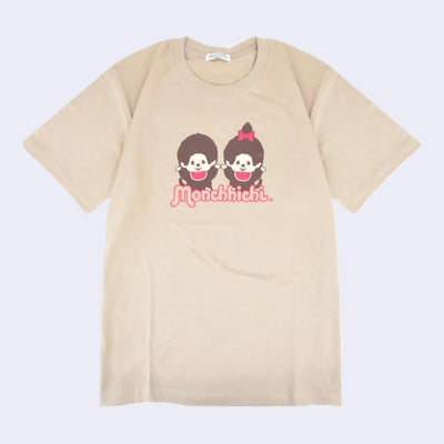 Beige t-shirt with two Monchhichi characters wearing matching red bibs and cheering with their hands up.