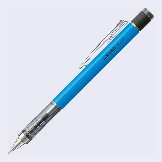 Blue mechanical pencil with transparent clip on a light gray background