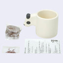 Growing kit disassembled so each part is seen: growing disc, seeds, instructions and an animal planter.