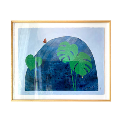 Collage style painting of a large rock on a solid blue background. Rock is dark blue with abstract subtle marbling. 3 large monstera leaves are in front of the rock, with a small orange butterfly atop it. Piece is in thin wooden frame.
