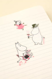 Translucent stickers of Moomin character stickers on a lined notebook page
