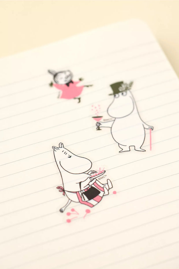 Translucent stickers of Moomin character stickers on a lined notebook page
