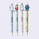Four cartoon character pens with colorful designs on a white background