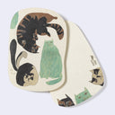 Rounded corner postcard with 3 cats on the front, in different poses and 3 cat heads peeking out on the back.