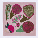 A square pink woven textile featuring a stylized botanical and bird pattern in pink, green, and brown, photographed flat against a light gray background.