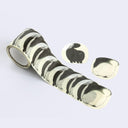 A roll of washi tape stickers with black cat silhouettes printed on it, shown as a long individual strip and 2 individual stickers.