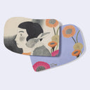 Rounded edge postcards with imagery on the front of an illustrated woman and a bunny with poppy flowers. Back is purple with poppy flowers.