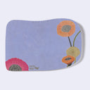 Rounded edge postcards with imagery on the front of an illustrated woman and a bunny with poppy flowers. Back is purple with poppy flowers.