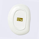 Bottom of a white oval-shaped plate, with a morita MiW logo.