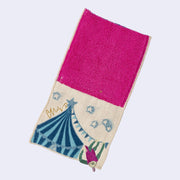 Rectangular textile with a pocket, the top can be folded over to make it into a pouch. Interior is bright fuchsia and exterior is beige with designs of a sloth hanging off of a circus tent.