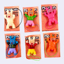 6 small vinyl figures of Morlin, a monster creature with bunny ears, 6 eyes and a visible crotch bulge. They all have their arms up and are either dressed in shirts that say "I <3 Pussy" or nude.