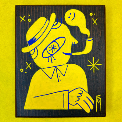 Yellow painting on a dark stained wooden panel of a character smiling and smoking a pipe with a ghost coming out of it, also smiling.