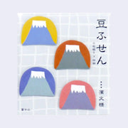 Sticker sheet with 4 3D stickers of Mt. Fuji, simplistically designed. Each sticker has its own rounded background color, like a setting sun/moon. Colors are: yellow, red, blue and pink.