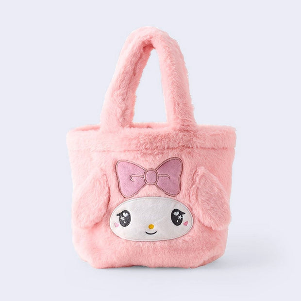 Fluffy pink faux fur handle bag with My Melody's face on the front with 3D fluffy ears and an embroidered pink box over her forehead. Her eyes have a cute, kawaii sparkle.
