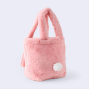 Fluffy pink faux fur handle bag, seen from the back with a small round white tail.