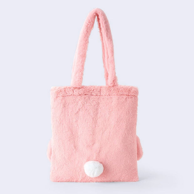 Fluffy pink faux fur tote bag, seen from the back - with a small white, round tail.