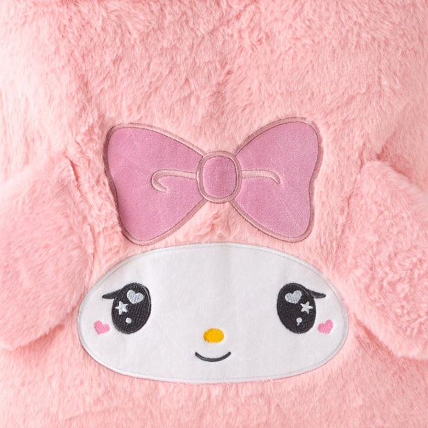 Fluffy pink faux fur tote bag with My Melody's face on the front with 3D fluffy ears and an embroidered pink box over her forehead. Her eyes have a cute, kawaii sparkle. Close up.